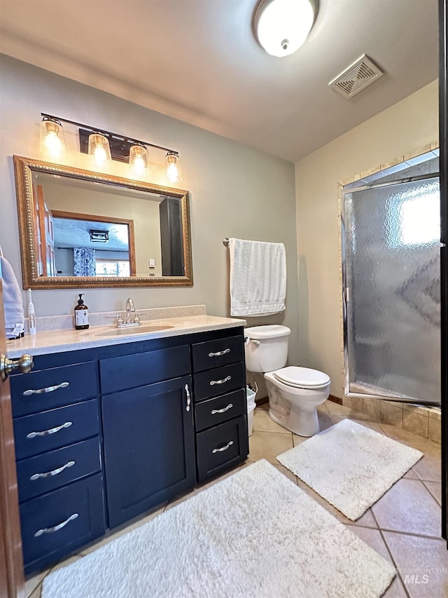 full bath featuring tile patterned flooring, visible vents, a shower stall, toilet, and vanity