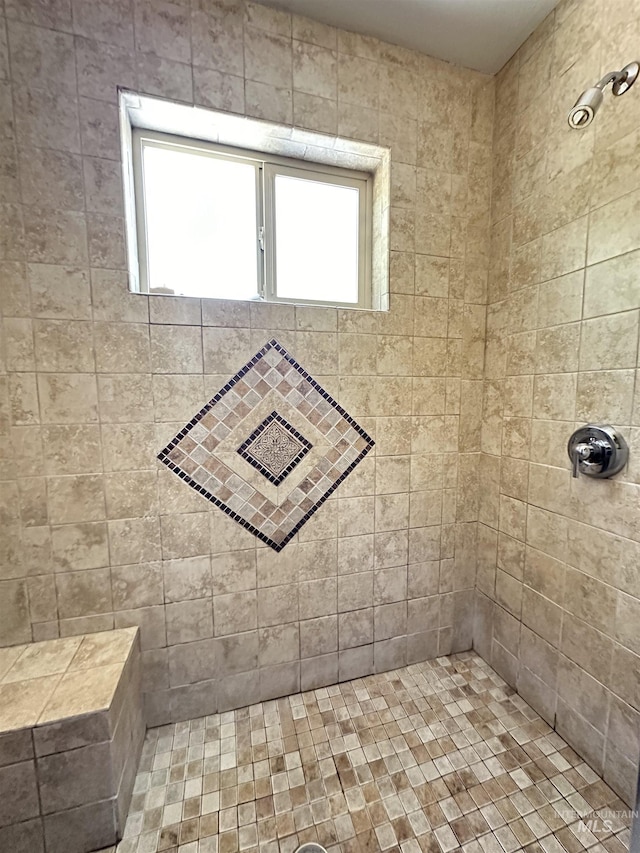 bathroom with tiled shower