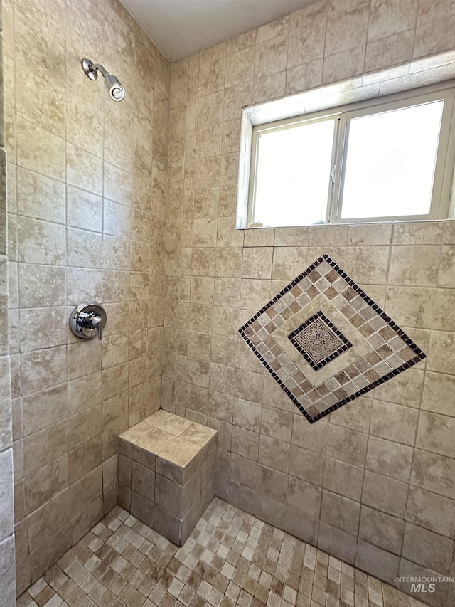 full bath featuring tiled shower