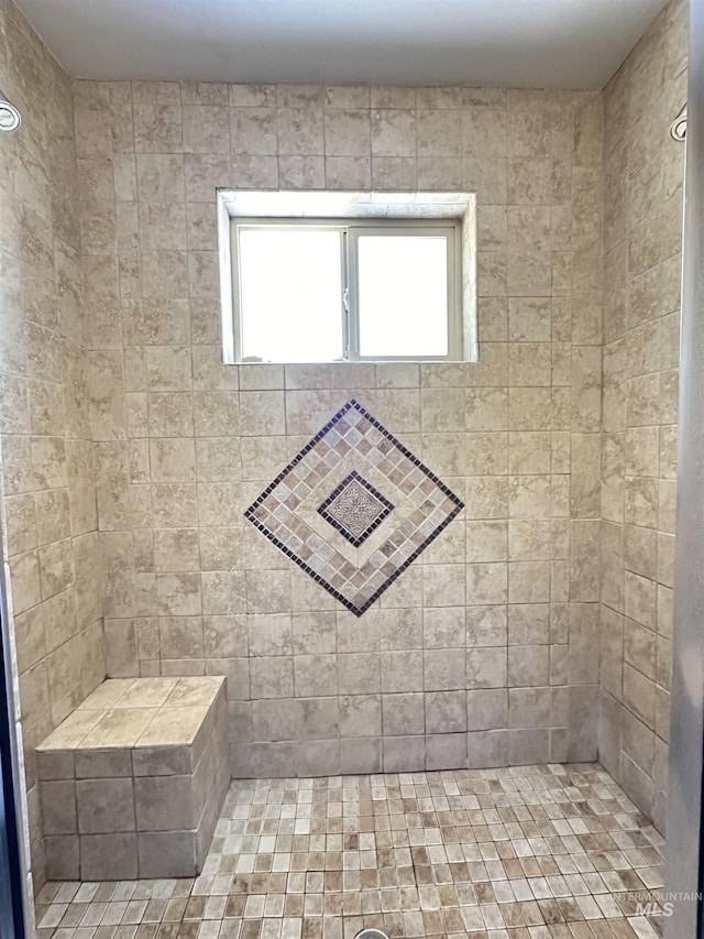 full bath featuring tiled shower