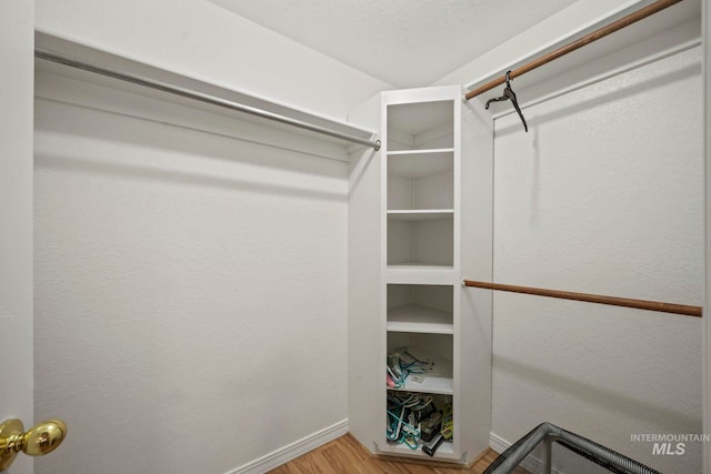 walk in closet featuring hardwood / wood-style floors