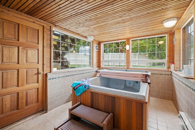 sunroom / solarium with wood ceiling, baseboard heating, plenty of natural light, and a jacuzzi