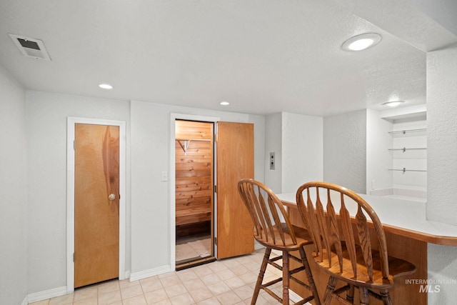 dining space featuring a textured ceiling