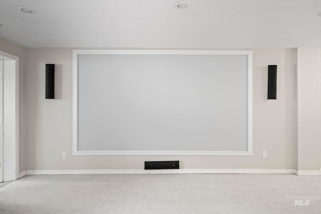 carpeted empty room with baseboards