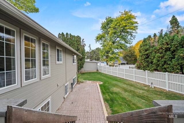 view of yard with a patio area and a fenced backyard
