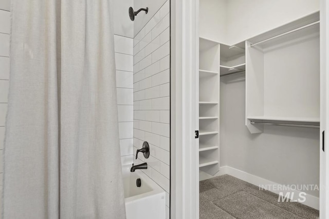 full bathroom featuring baseboards and shower / bath combo