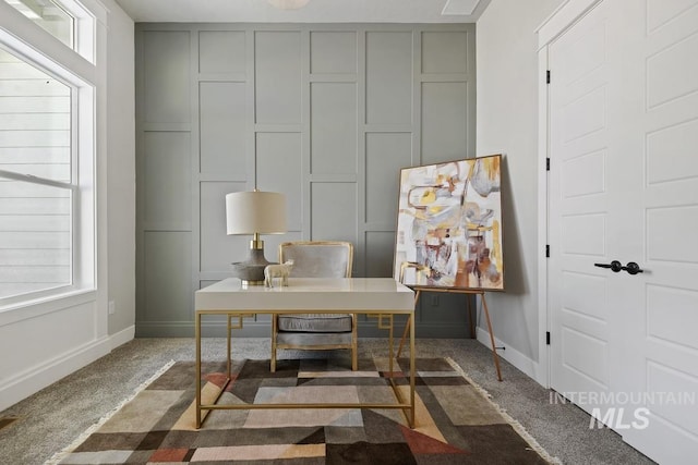 office area with baseboards, carpet flooring, and a wealth of natural light