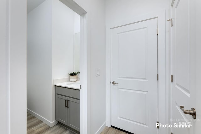 bathroom with vanity and hardwood / wood-style floors