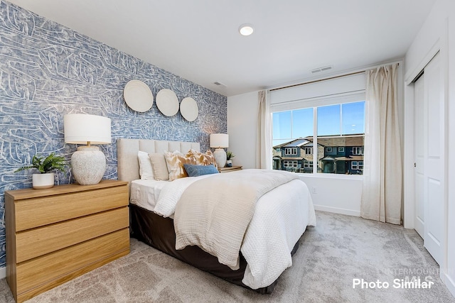 bedroom with light carpet