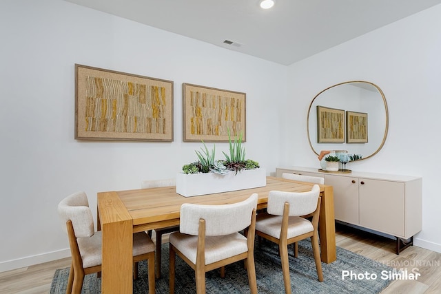 dining room with light wood-type flooring