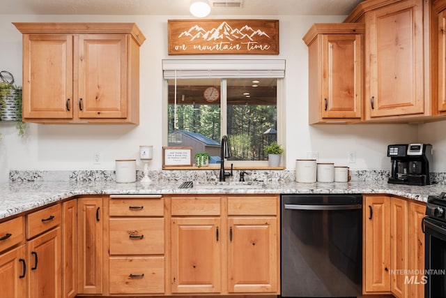 kitchen featuring dishwasher, a sink, light stone countertops, black gas range, and light brown cabinetry