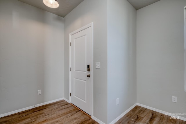 entrance foyer with wood finished floors and baseboards