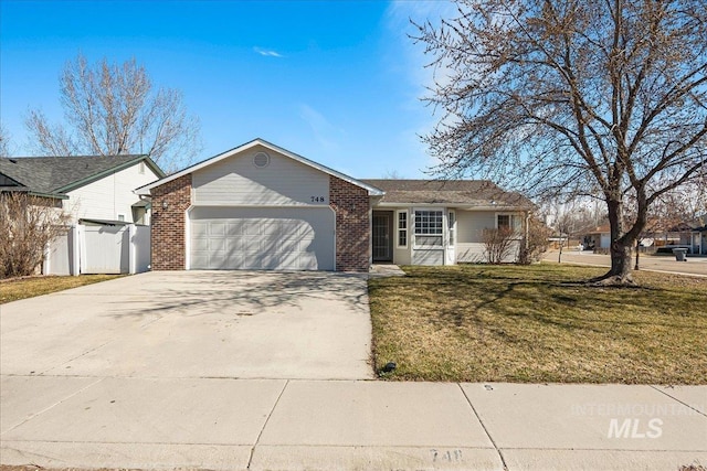 ranch-style home with a front yard, fence, driveway, a garage, and brick siding