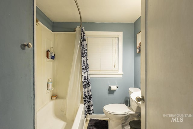 bathroom with toilet and shower / bathtub combination with curtain