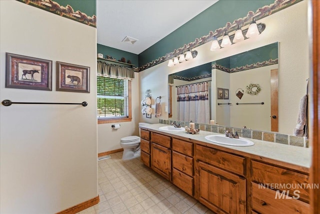 bathroom with vanity and toilet