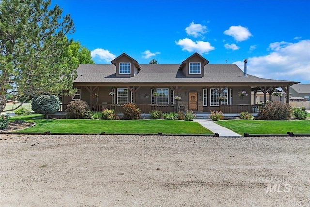 view of front of house with a front yard and a porch