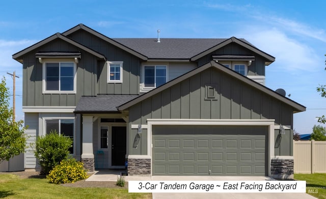 1417 Scranton Ave, Caldwell, ID 83605 - craftsman house with roof with shingles, an attached garage, stone siding, driveway, and board and batten siding
