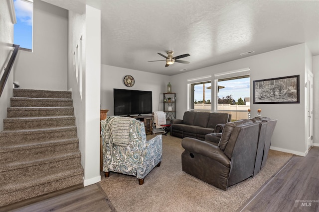 1417 Scranton Ave, Caldwell, ID 83605 - living area with wood finished floors, a ceiling fan, stairs, baseboards, and a textured ceiling