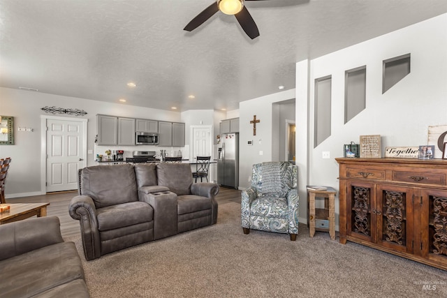 1417 Scranton Ave, Caldwell, ID 83605 - living room featuring a ceiling fan, baseboards, recessed lighting, and carpet flooring