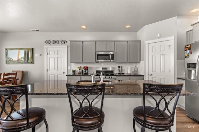 1417 Scranton Ave, Caldwell, ID 83605 - kitchen with stainless steel appliances, gray cabinetry, a sink, and recessed lighting