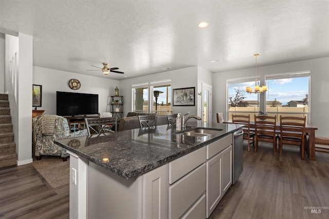 1417 Scranton Ave, Caldwell, ID 83605 - kitchen featuring a sink, dark wood finished floors, dishwasher, dark stone counters, and ceiling fan