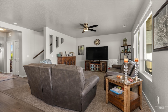 1417 Scranton Ave, Caldwell, ID 83605 - living area featuring ceiling fan, baseboards, wood finished floors, stairs, and a textured ceiling