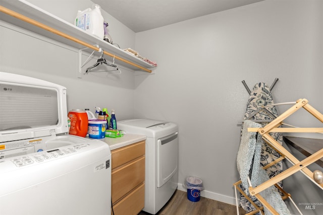 1417 Scranton Ave, Caldwell, ID 83605 - laundry area with wood finished floors, washing machine and dryer, and baseboards