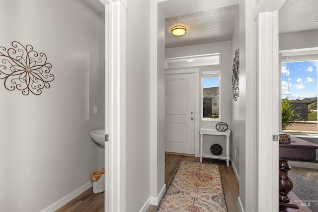 1417 Scranton Ave, Caldwell, ID 83605 - laundry room featuring wood finished floors and baseboards