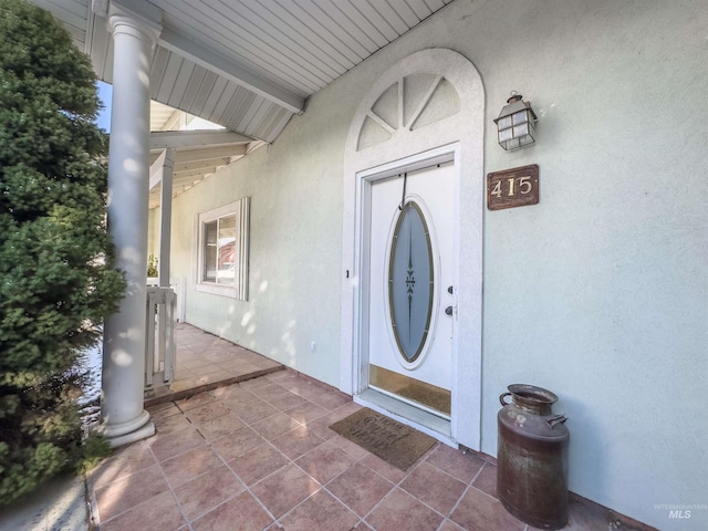 property entrance featuring covered porch