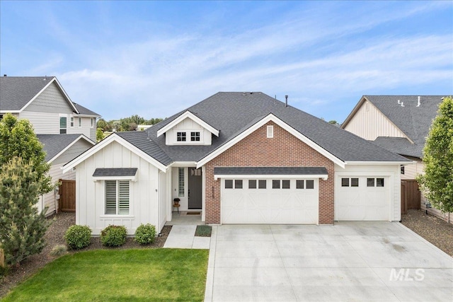 4923 W Canaston St, Meridian, ID 83646 - view of front of house with an attached garage, board and batten siding, concrete driveway, brick siding, and a shingled roof