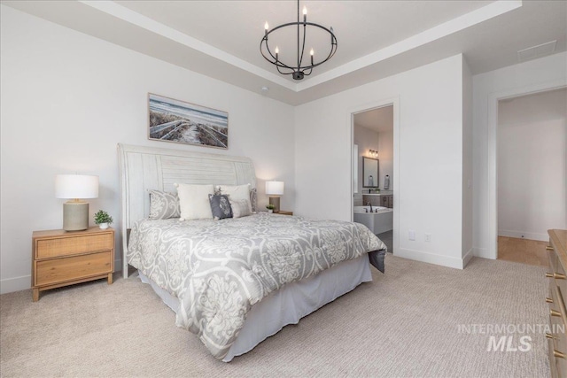 4923 W Canaston St, Meridian, ID 83646 - bedroom with a chandelier, light colored carpet, baseboards, ensuite bathroom, and a tray ceiling