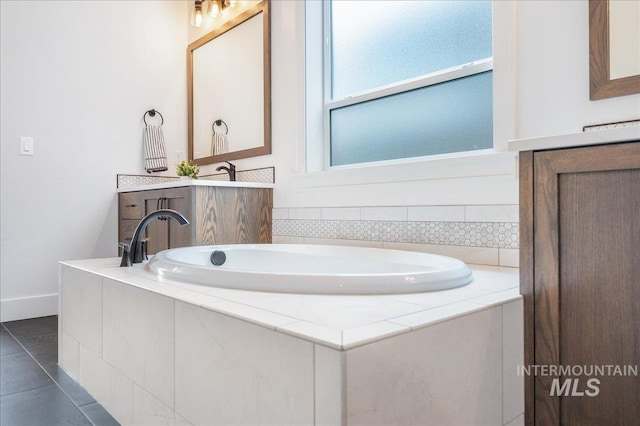 4923 W Canaston St, Meridian, ID 83646 - bathroom featuring a garden tub and tile patterned flooring