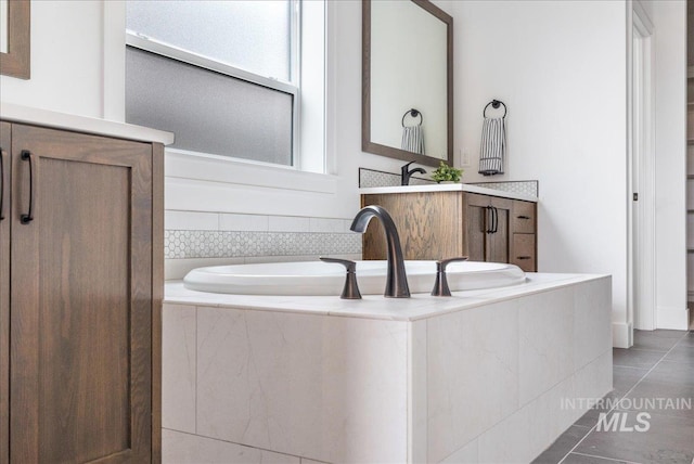 4923 W Canaston St, Meridian, ID 83646 - bathroom featuring tile patterned floors and a garden tub