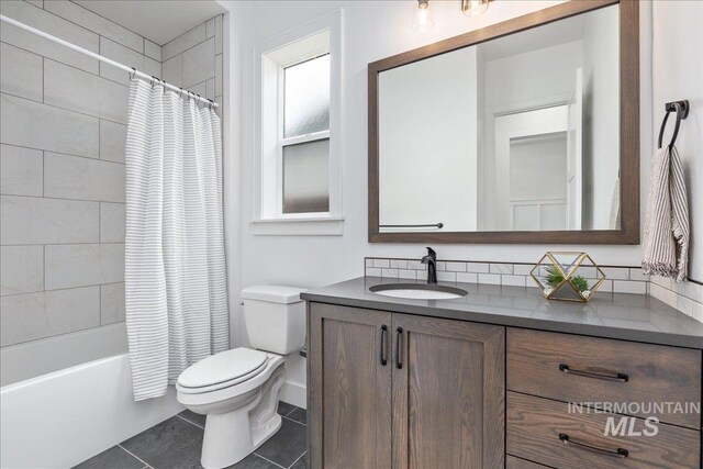4923 W Canaston St, Meridian, ID 83646 - full bathroom featuring toilet, vanity, tile patterned floors, and shower / bath combo with shower curtain