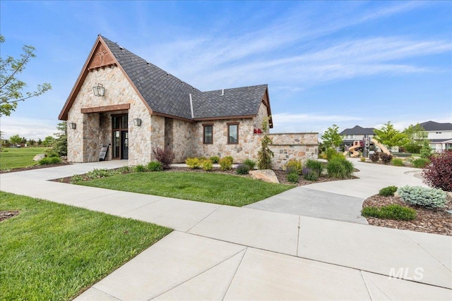 4923 W Canaston St, Meridian, ID 83646 - view of front facade with stone siding and a front lawn