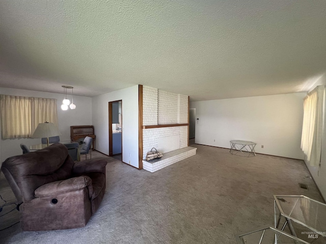 1069 Lucky Ln, Ontario, OR 97914 - living area with a textured ceiling and carpet