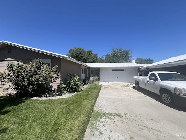 1069 Lucky Ln, Ontario, OR 97914 - view of side of property with metal roof and a yard