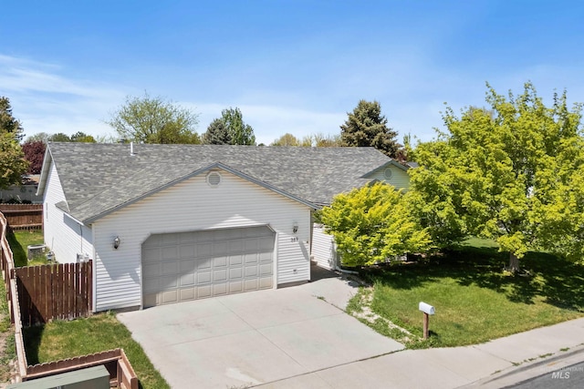 389 Trotter Dr, Twin Falls, ID 83301 - view of front of home featuring roof with shingles, a garage, and concrete driveway
