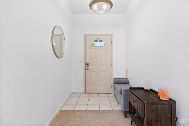 389 Trotter Dr, Twin Falls, ID 83301 - entrance foyer featuring light carpet, light tile patterned floors, and baseboards
