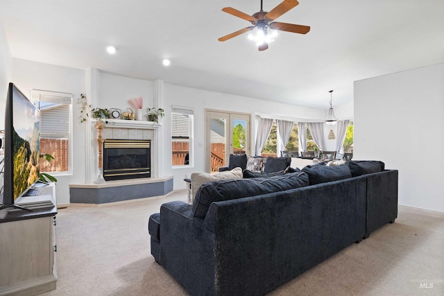 389 Trotter Dr, Twin Falls, ID 83301 - living area with light colored carpet, a ceiling fan, a tile fireplace, and recessed lighting