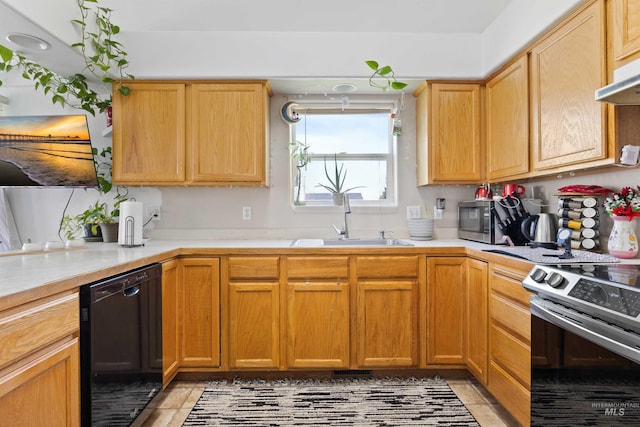 389 Trotter Dr, Twin Falls, ID 83301 - kitchen with stainless steel appliances, a sink, light countertops, light tile patterned flooring, and under cabinet range hood