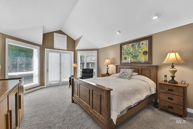 bedroom with vaulted ceiling, light carpet, and access to exterior