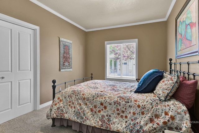 carpeted bedroom featuring crown molding and baseboards