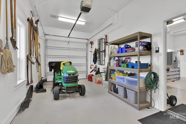 garage featuring a garage door opener