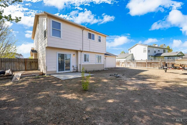 660 Teton, Mountain Home, ID 83647 - rear view of property featuring a patio area and a fenced backyard
