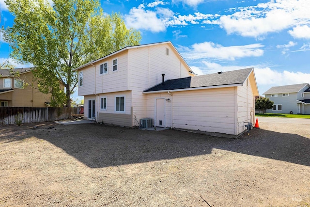 660 Teton, Mountain Home, ID 83647 - rear view of property featuring cooling unit and fence