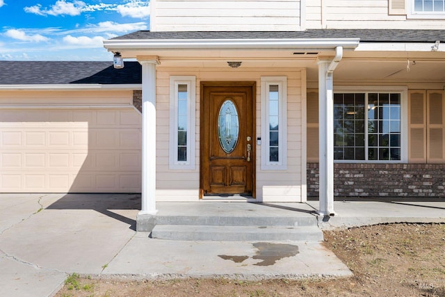 660 Teton, Mountain Home, ID 83647 - entrance to property featuring concrete driveway, a garage, and a shingled roof