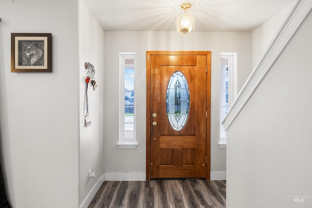 660 Teton, Mountain Home, ID 83647 - foyer with baseboards, dark wood-style floors, and plenty of natural light