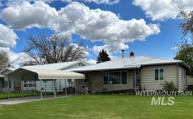 view of front facade with a front yard and a carport