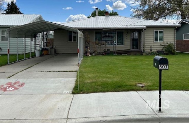 ranch-style house with a carport and a front lawn